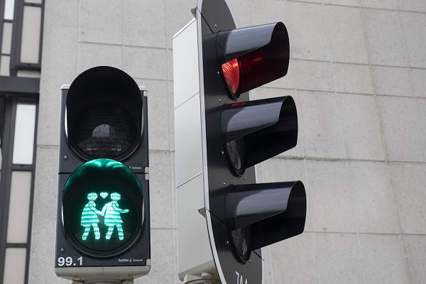 Traffic lights showing two women holding hands 